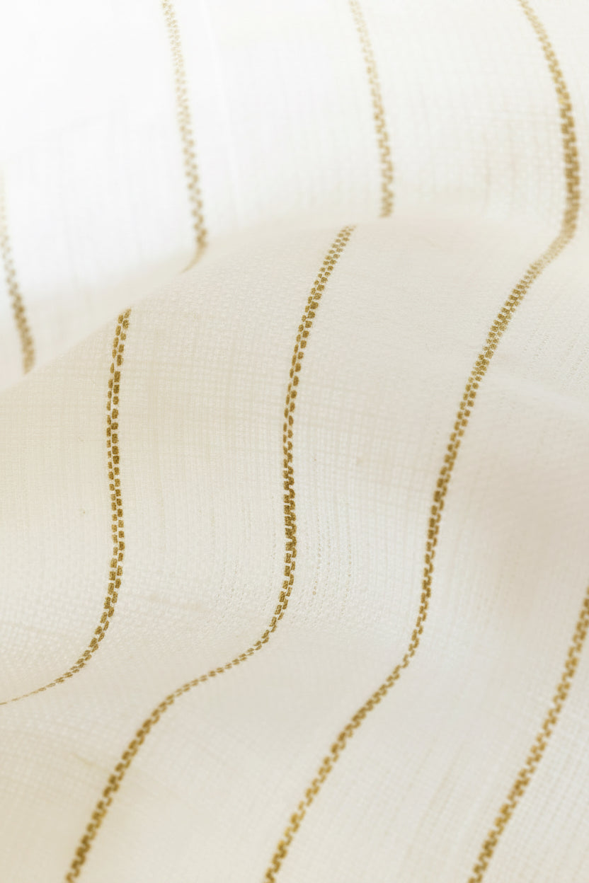 Close-up of a white or off-white woven fabric with vertical wavy stripes in a muted olive-brown or taupe color.